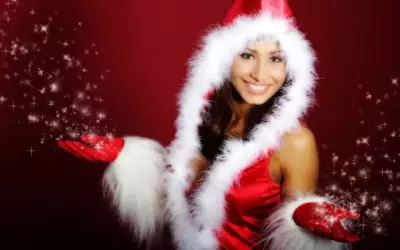 Christmas Joy: Girl in Santa Dress Spreads Festive Cheer