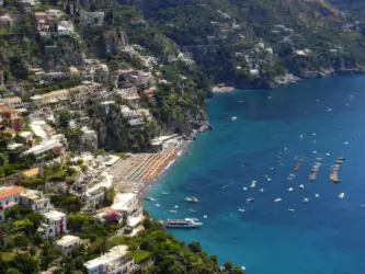 View of Amalfi Coast Beach with golden sands and crystal-clear waters