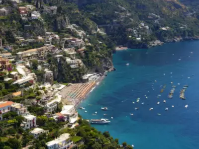 View of Amalfi Coast Beach with golden sands and crystal-clear waters