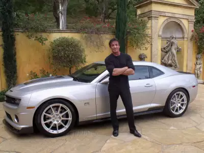 Sylvester Stallone with Silver Muscle Car Wallpaper