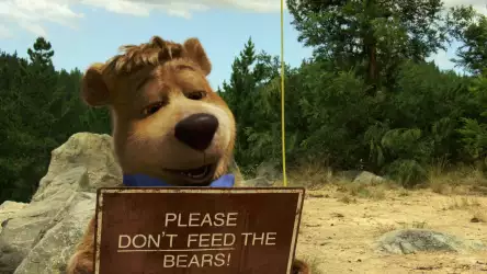 Yogi Bear Holding a 'Do Not Feed Bears' Sign Wallpaper