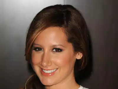 Ashley Tisdale smiling and signing books at Barnes & Noble