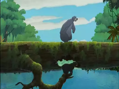 Baloo walking on a moss-covered jungle bridge while Bagheera moves underneath by the river in The Jungle Book 2.