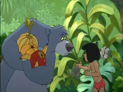 Baloo holding fruits while talking to Mowgli in the jungle from The Jungle Book 2