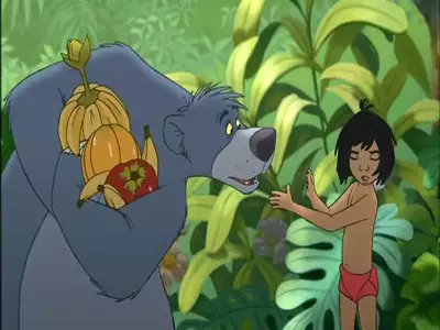 Baloo holding a bunch of jungle fruits while Mowgli gestures as if refusing in The Jungle Book 2.