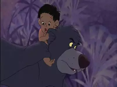 Baloo carrying Ranjan on his back through the jungle at night from The Jungle Book 2