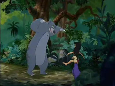 Baloo and Shanti joyfully playing in the jungle, a scene from The Jungle Book 2