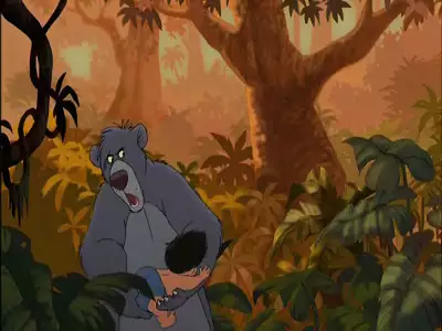 Baloo looking surprised as Mowgli clings to him in The Jungle Book 2