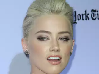 Amber Heard at The Rum Diary Premiere with Blonde Colors Wallpaper