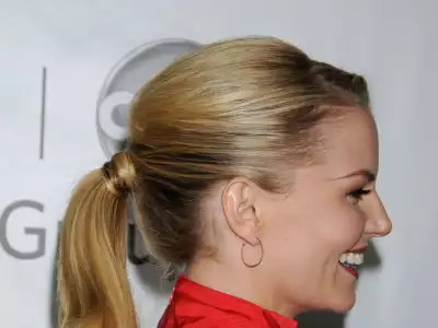 Side view of Jennifer Morrison at TCA Winter Press Tour, showcasing her elegant appearance on the red carpet