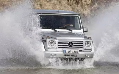 Mercedes-Benz G Class confidently driving through water, showcasing its off-road capability