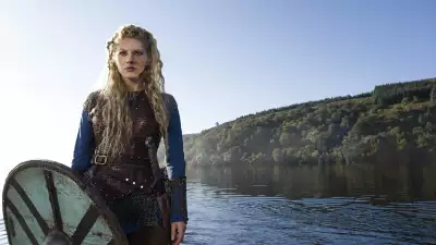 Katheryn Winnick as Lagertha from Vikings standing by the water