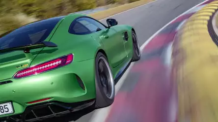 Green Mercedes AMG GT R showcasing its power and dynamism on the road