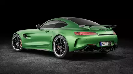 The Mercedes AMG GT R in a striking green color, a symbol of power and style