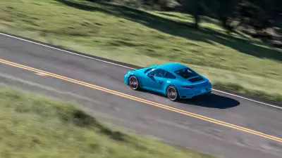 Blue Porsche Carrera: A symphony of speed and elegance on the road